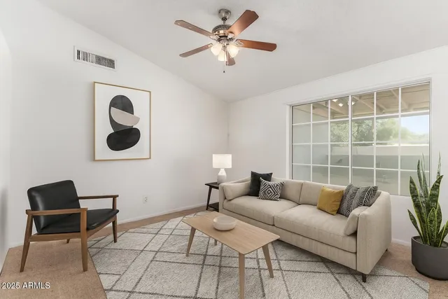 a living room with furniture and a window