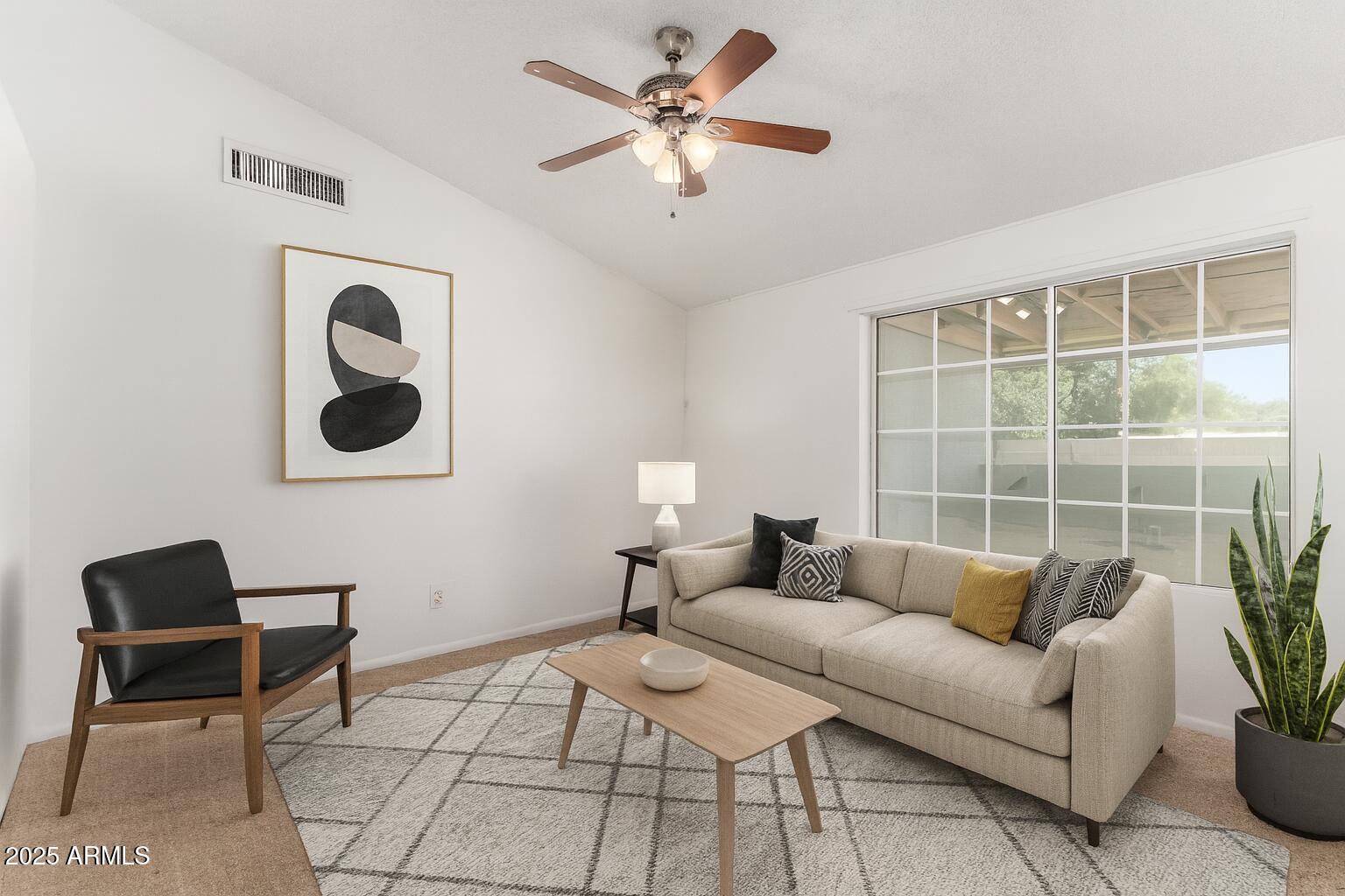 3419 North 70th Avenue Phoenix, AZ 85033 - Photo 7 of 31 a living room with furniture and a window