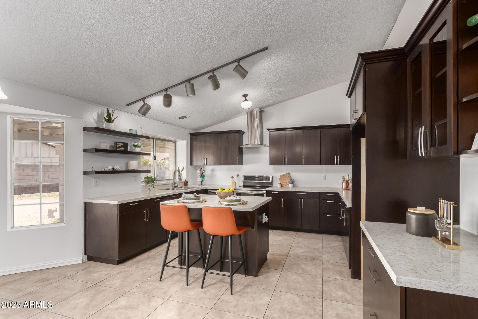 3419 North 70th Avenue Phoenix, AZ 85033 - Photo 8 of 31 a kitchen with a stove a refrigerator and a sink