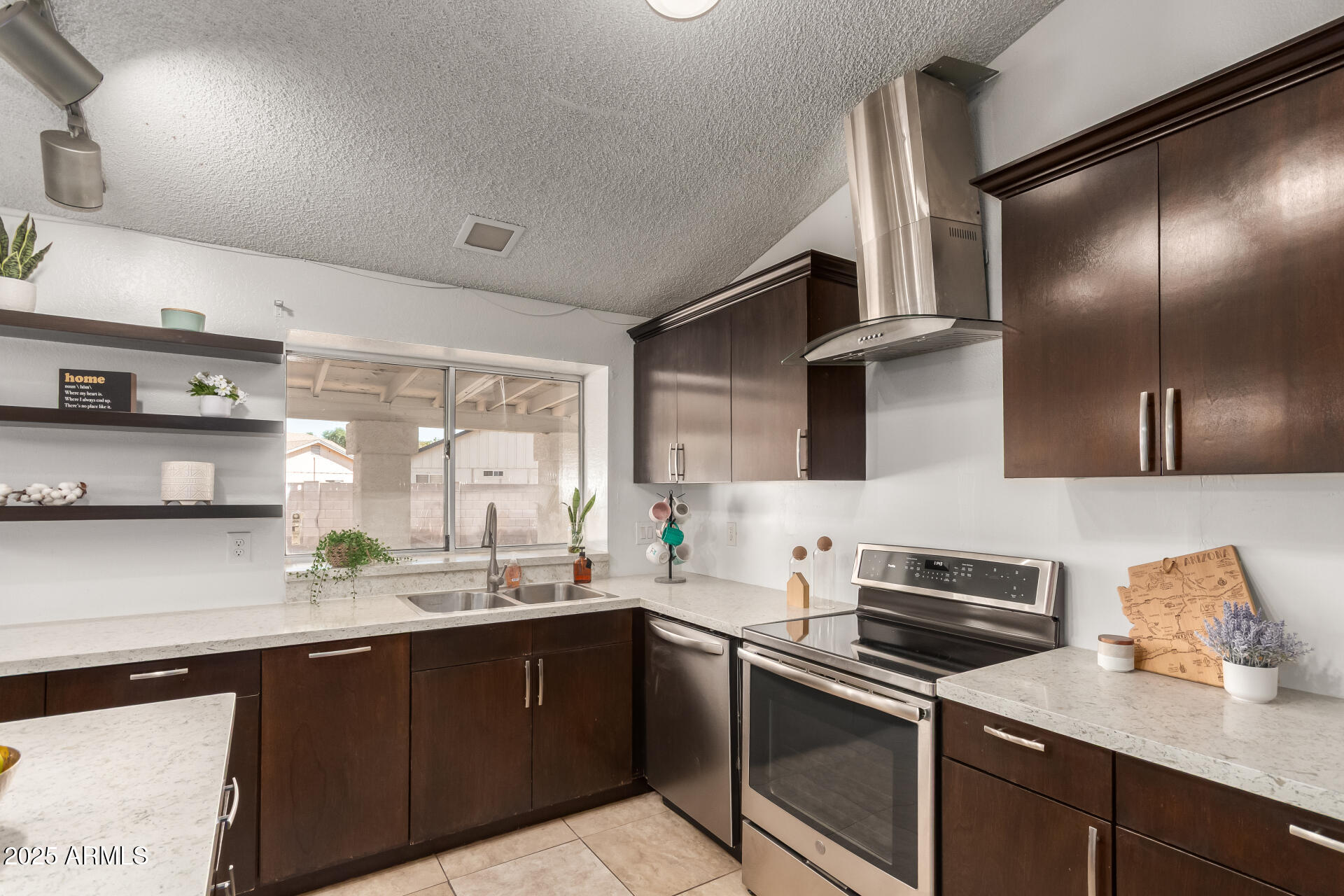3419 North 70th Avenue Phoenix, AZ 85033 - Photo 10 of 31 a kitchen with a sink and stainless steel appliances