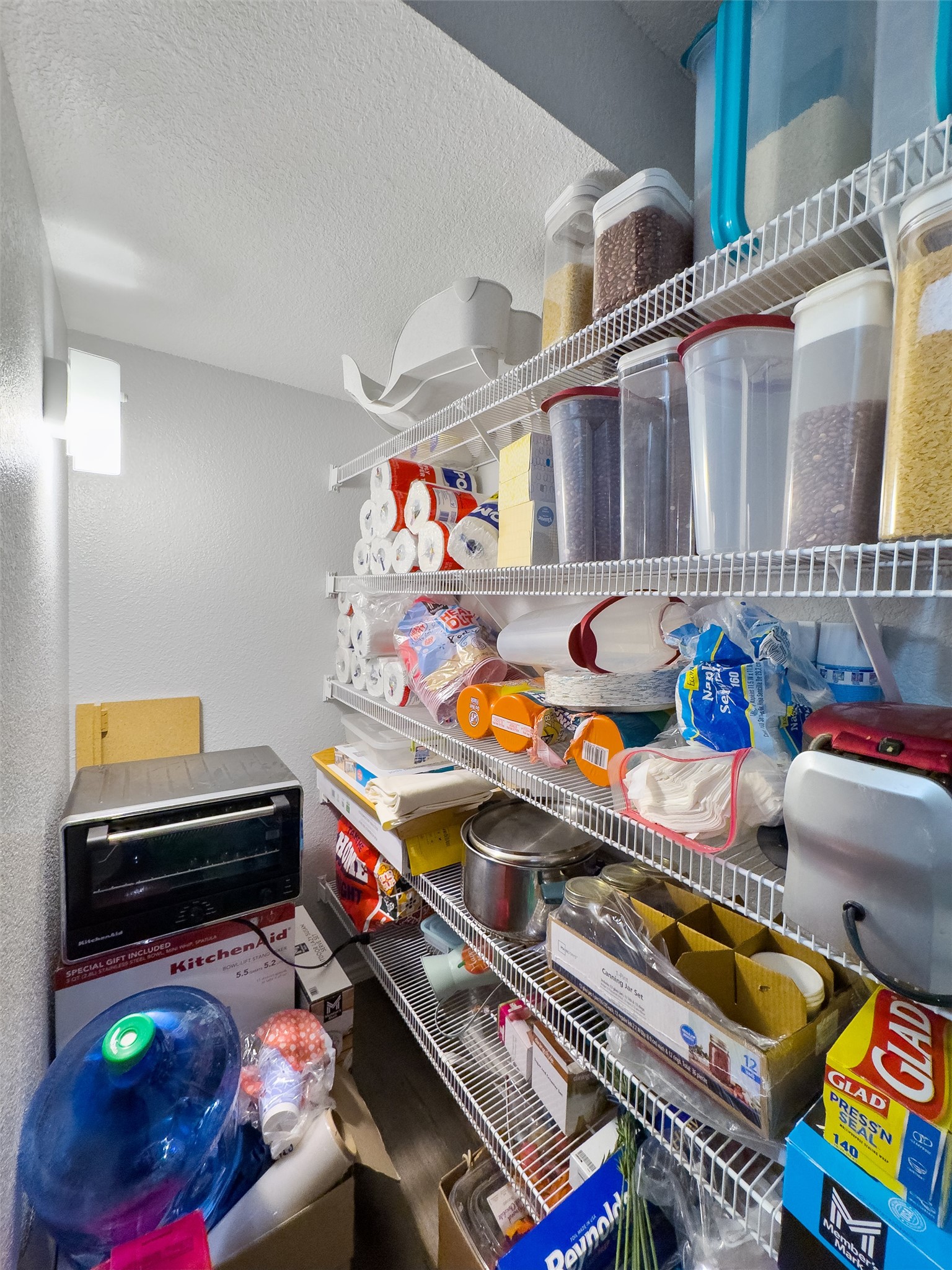 1833 Thompson Trail Round Rock, TX 78664 - Photo 12 of 40 Well-organized pantry storage features multiple shelves, providing ample space for kitchen essentials and small appliances.
