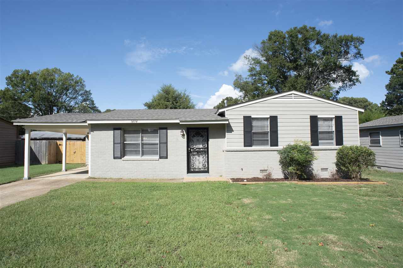 1494 Winfield Road Memphis, TN 38116 - Photo 1 of 20 a front view of a house with a yard and garage