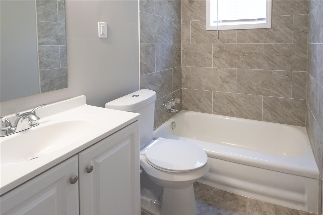 1494 Winfield Road Memphis, TN 38116 - Photo 15 of 20 a bathroom with a sink and a toilet