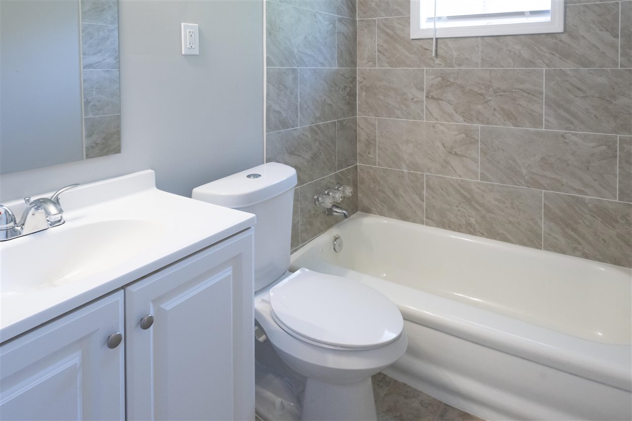 1494 Winfield Road Memphis, TN 38116 - Photo 16 of 20 a bathroom with a sink a toilet and bathtub
