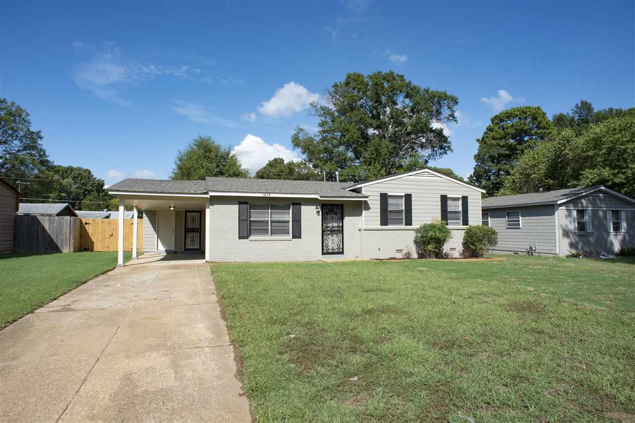 1494 Winfield Road Memphis, TN 38116 - Photo 18 of 20 a front view of a house with a garden