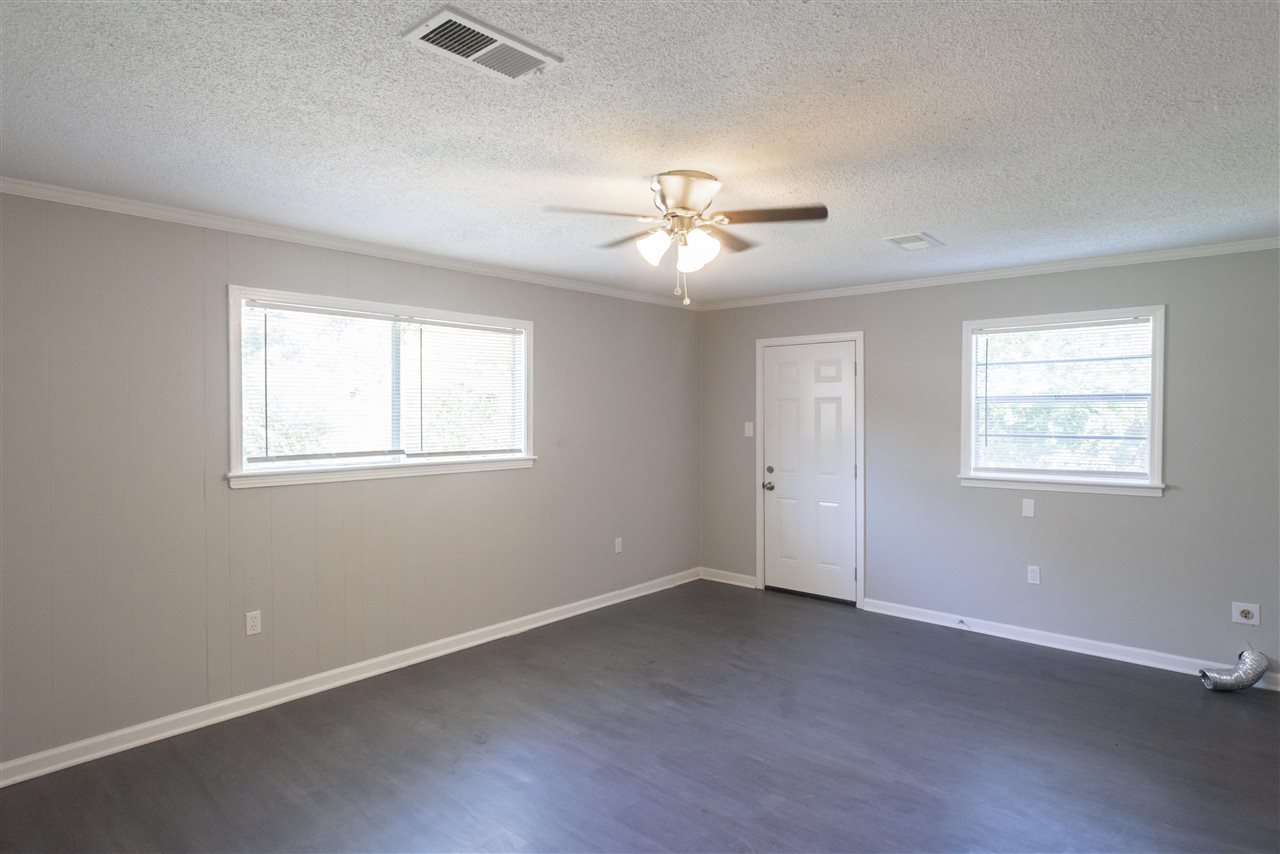 1494 Winfield Road Memphis, TN 38116 - Photo 3 of 20 a view of a room with a ceiling fan and a window