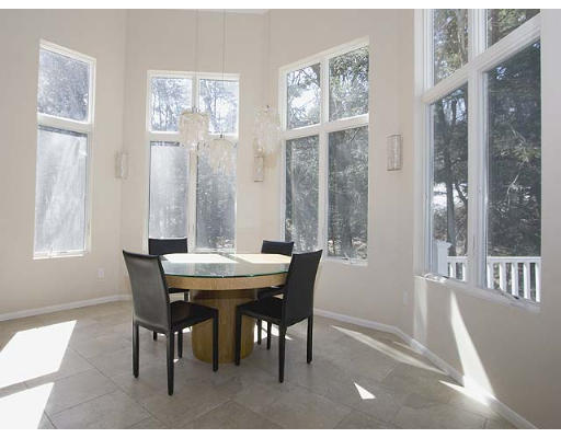 51 Squire Road Winchester, MA 01890 - Photo 3 of 24 a view of a dining room with furniture wooden floor and a chandelier