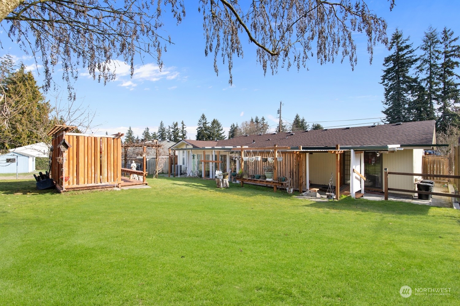 5214 West Highland Road Everett, WA 98203 - Photo 22 of 36 a view of a house with backyard and a tree