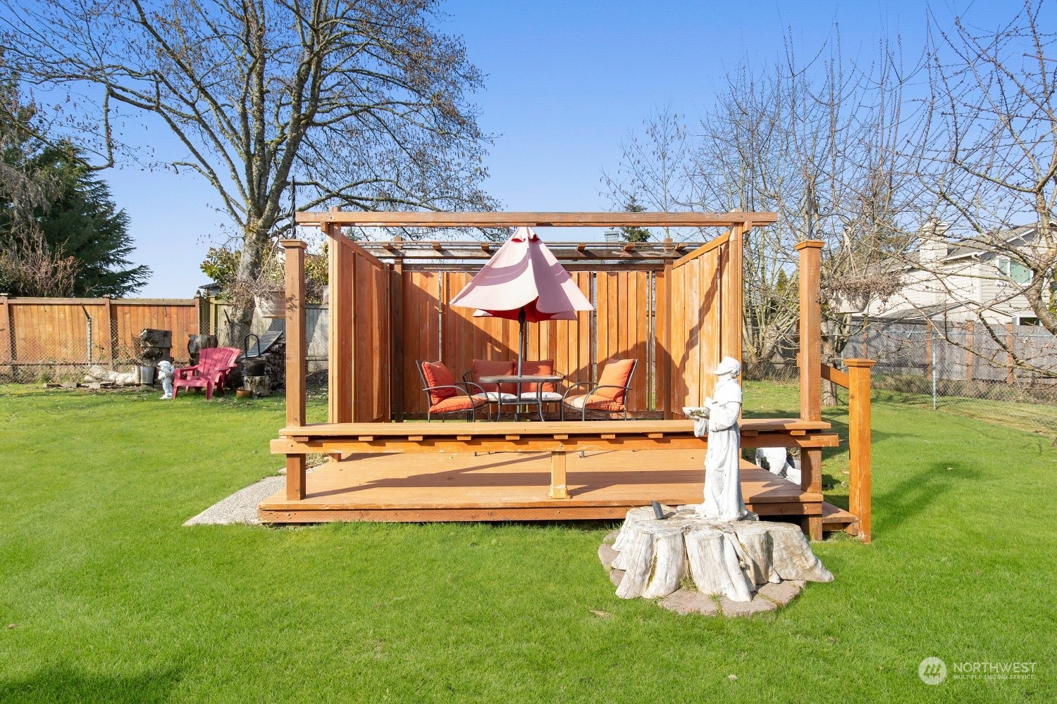 5214 West Highland Road Everett, WA 98203 - Photo 25 of 36 a view of a backyard with a table and chair