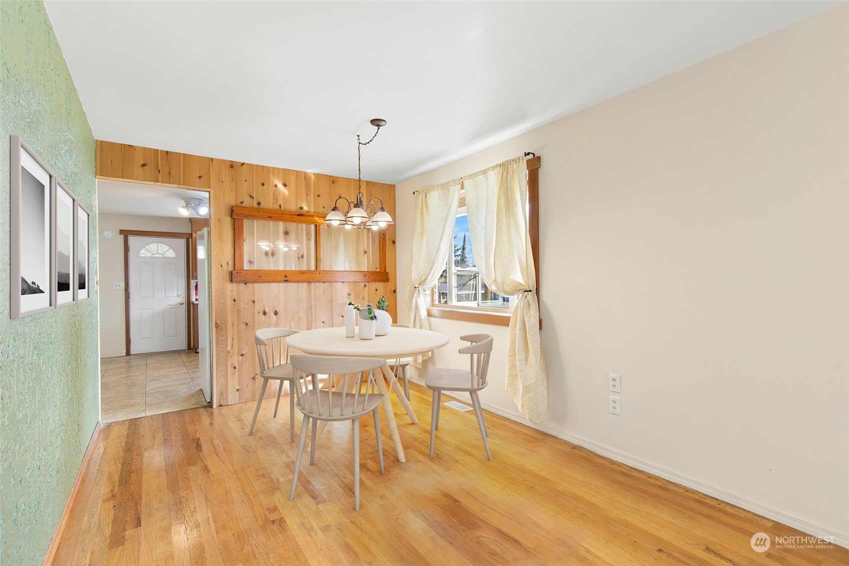 5214 West Highland Road Everett, WA 98203 - Photo 8 of 36 a view of a dining room with furniture and wooden floor
