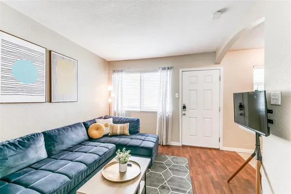 a living room with furniture and a table