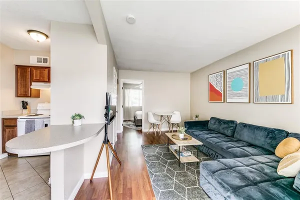 a living room with furniture and a table