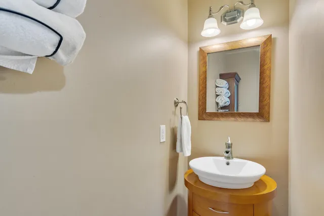 a bedroom with a bed and a chair