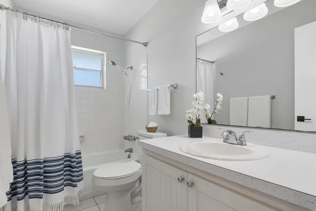 a view of a lake with houses in the back