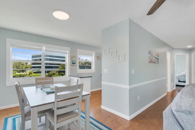 a kitchen with stainless steel appliances granite countertop a sink and a refrigerator