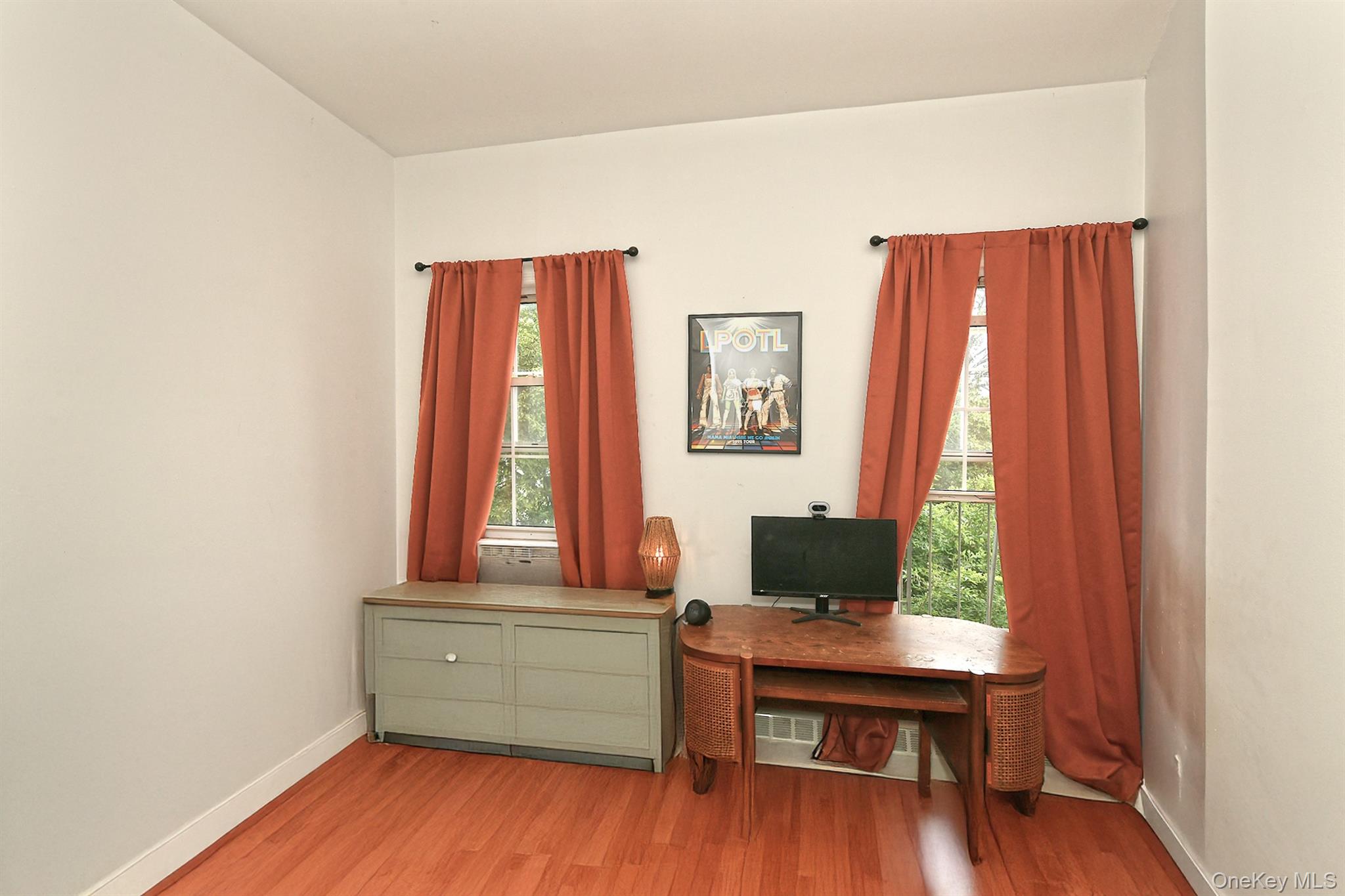 1244 Jefferson Avenue Brooklyn, NY 11221 - Photo 14 of 21 a room with a window and wooden floor