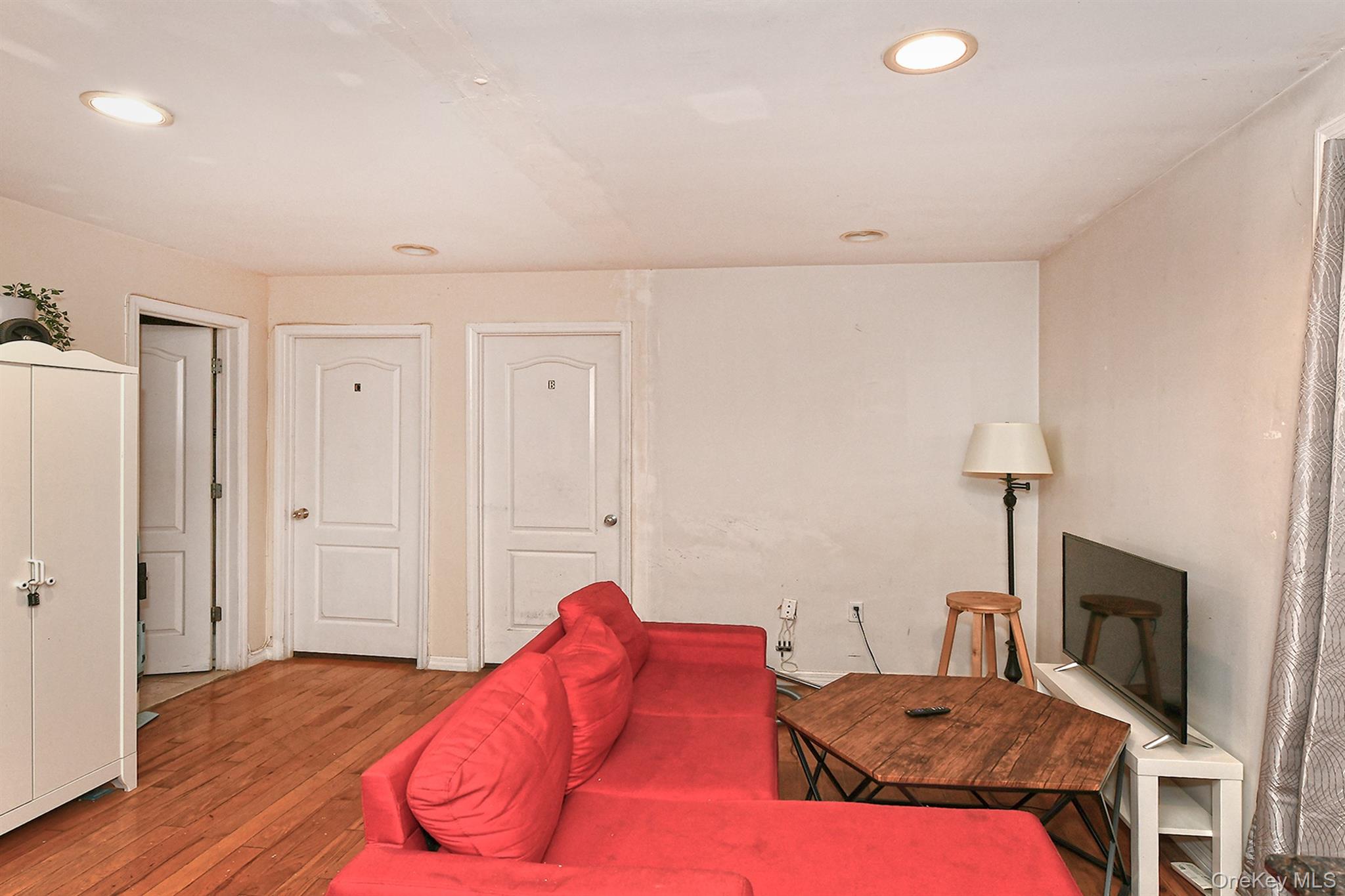 1244 Jefferson Avenue Brooklyn, NY 11221 - Photo 5 of 21 a bedroom with a bed and a lamp