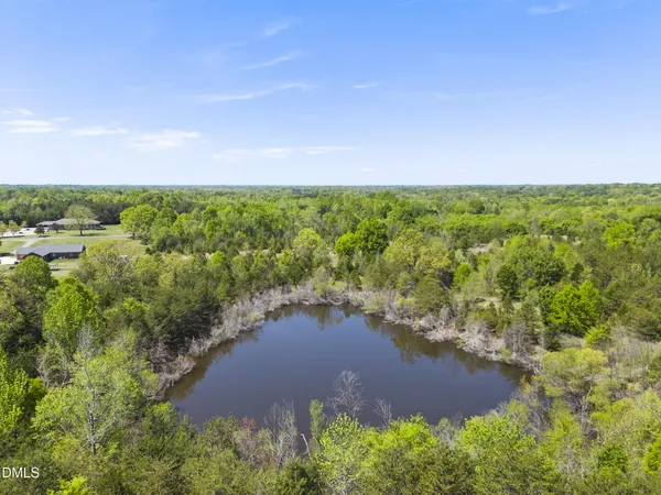 a view of a lake with a yard