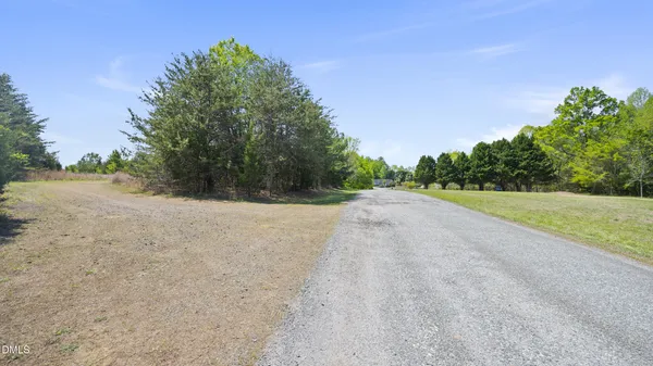 a view of a road with a yard