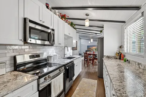 a kitchen with a stove and a microwave