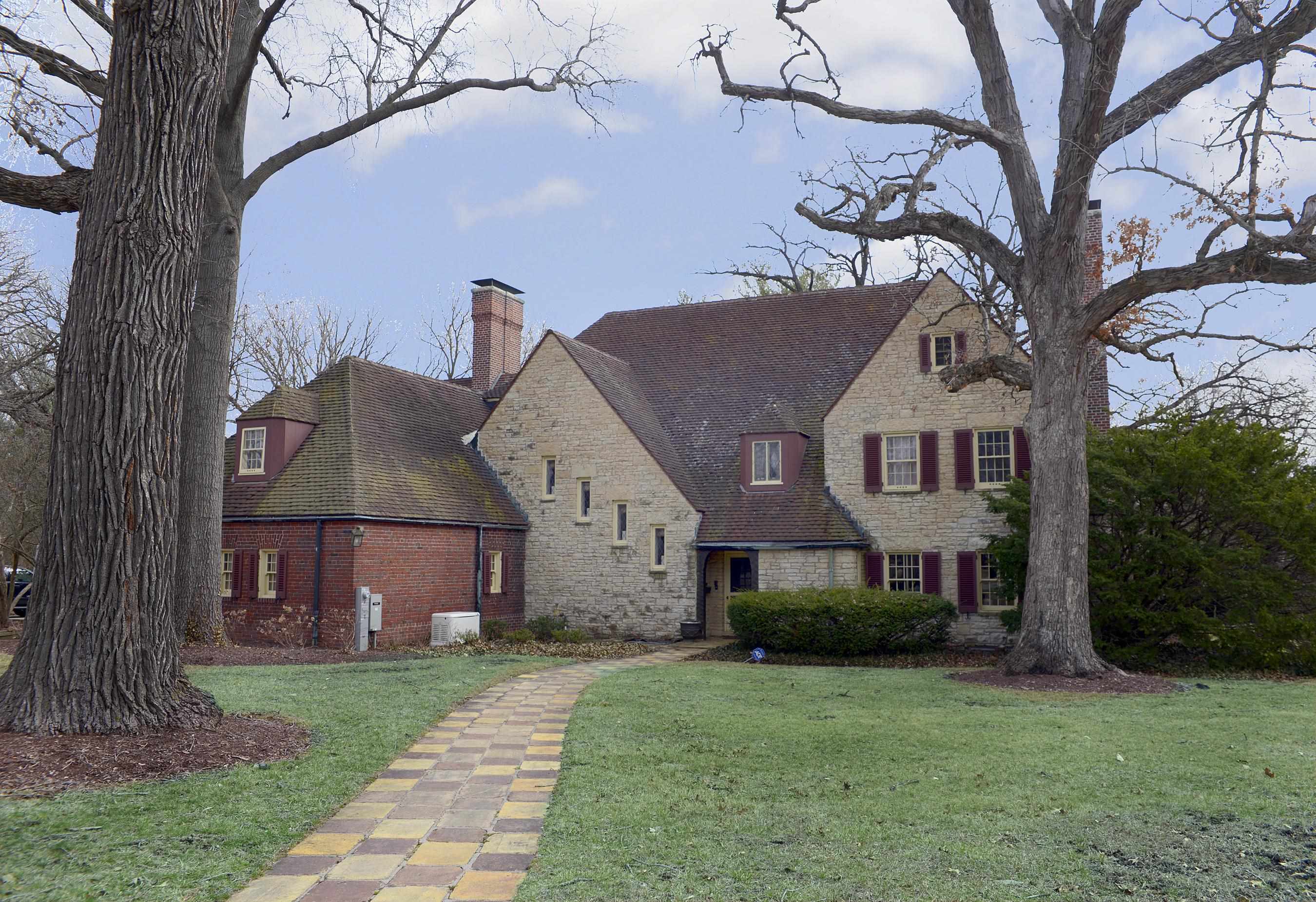 2221 Twin Oak Road Peru, IL 61354 - Photo 50 of 63 a front view of a house with a garden and tree