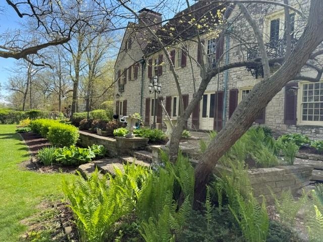 2221 Twin Oak Road Peru, IL 61354 - Photo 58 of 63 a front view of a house with a yard and potted plants