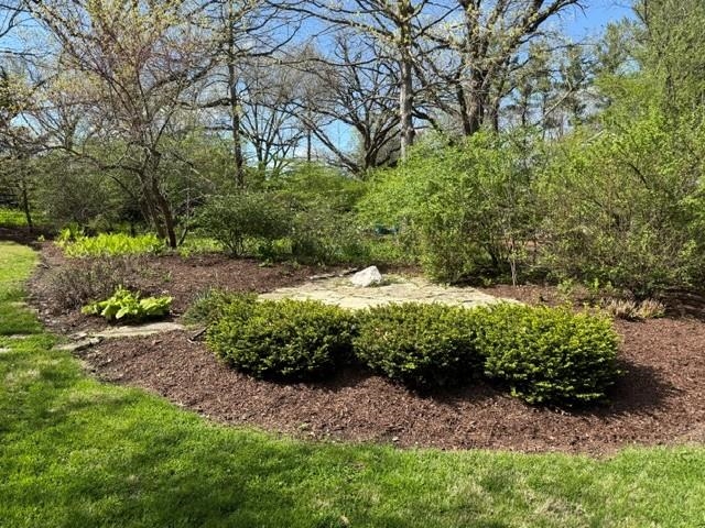 2221 Twin Oak Road Peru, IL 61354 - Photo 62 of 63 a view of a garden with a tree