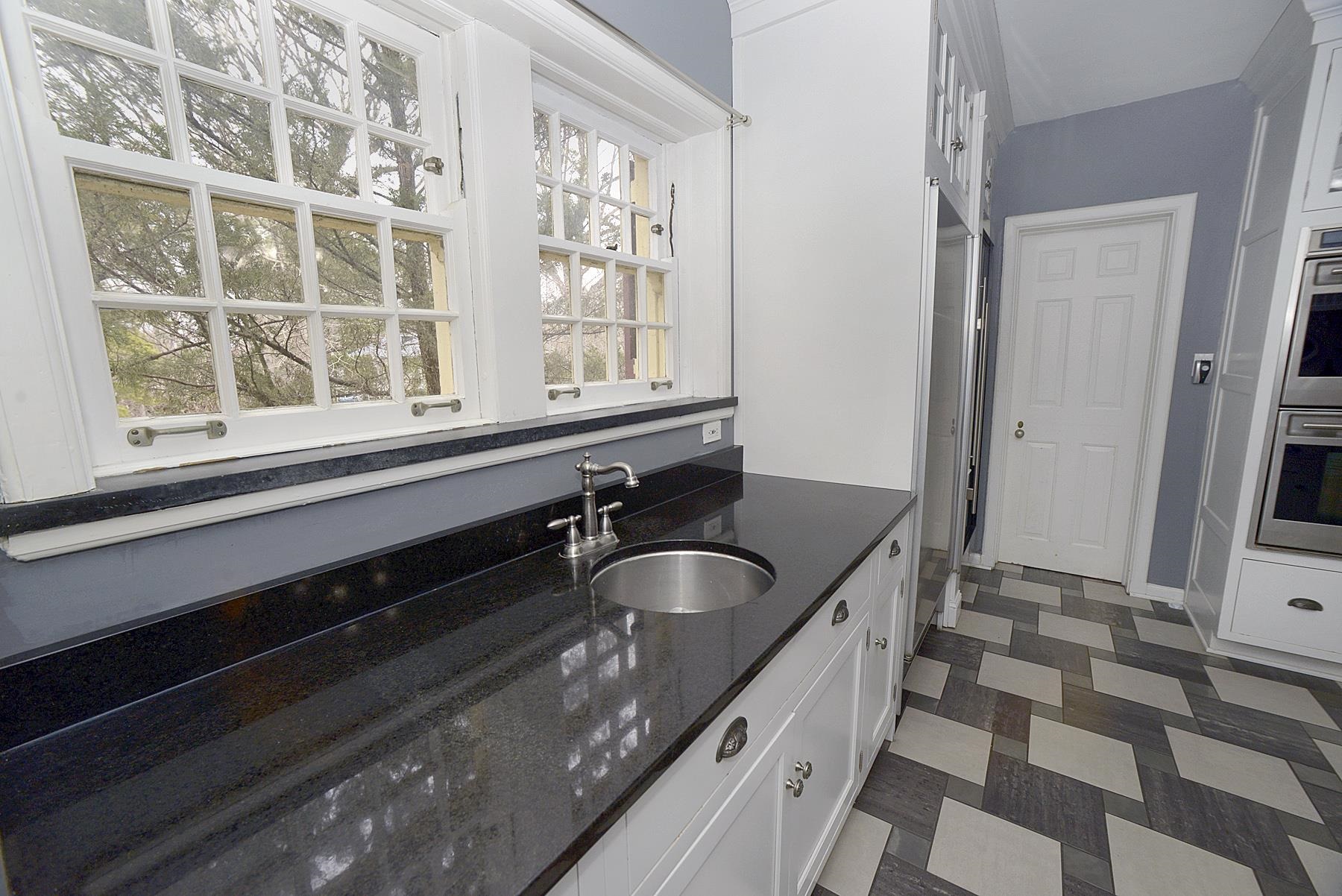 2221 Twin Oak Road Peru, IL 61354 - Photo 10 of 63 a bathroom with a granite countertop sink and a bathtub