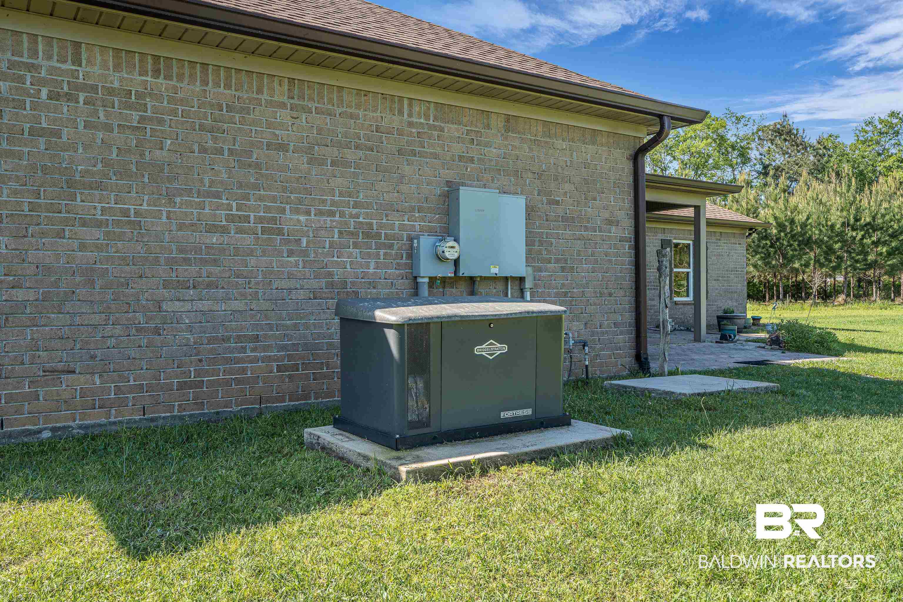 18255 Cactus Court Elberta, AL 36530 - Photo 5 of 53 Exterior view of brick siding, a downspout, and gutters