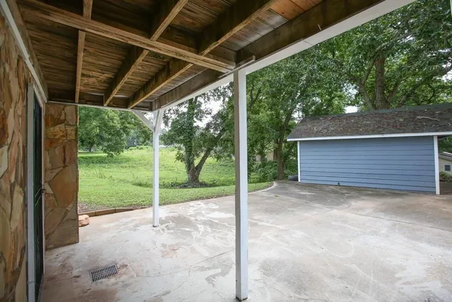 a view of backyard with green space