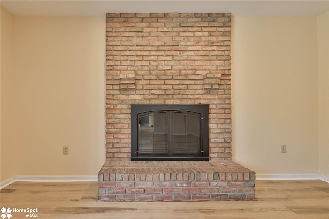 4059 Wedgewood Road Allentown, PA 18104 - Photo 29 of 72 A classic brick fireplace with a raised hearth forms a cozy focal point.