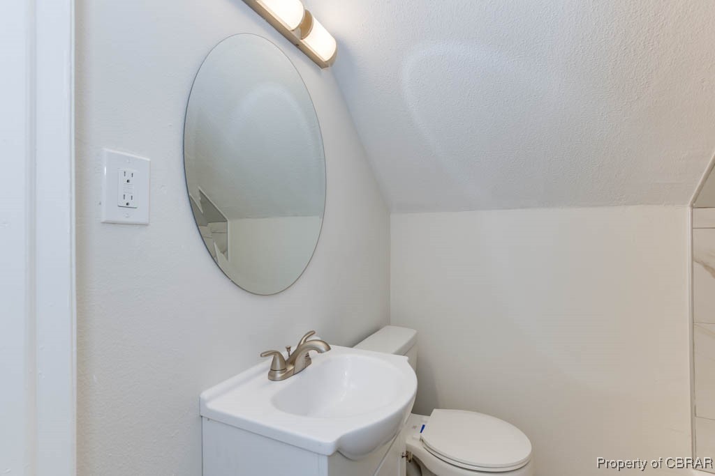 3310 West Weaver Road Hampton, VA 23666 - Photo 23 of 28 a bathroom with a toilet sink and mirror