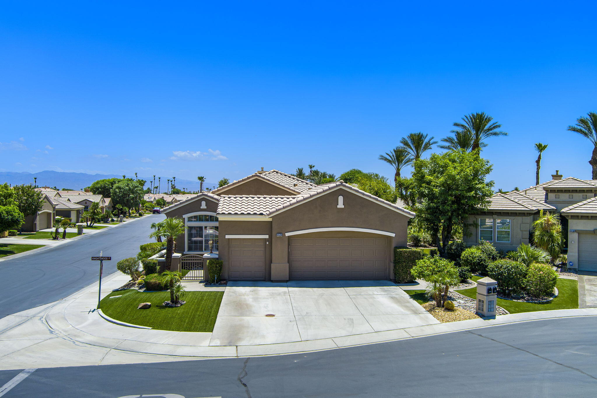 44528 Knightswood Road Indio, CA 92201 - Photo 1 of 46 a front view of a house with garden