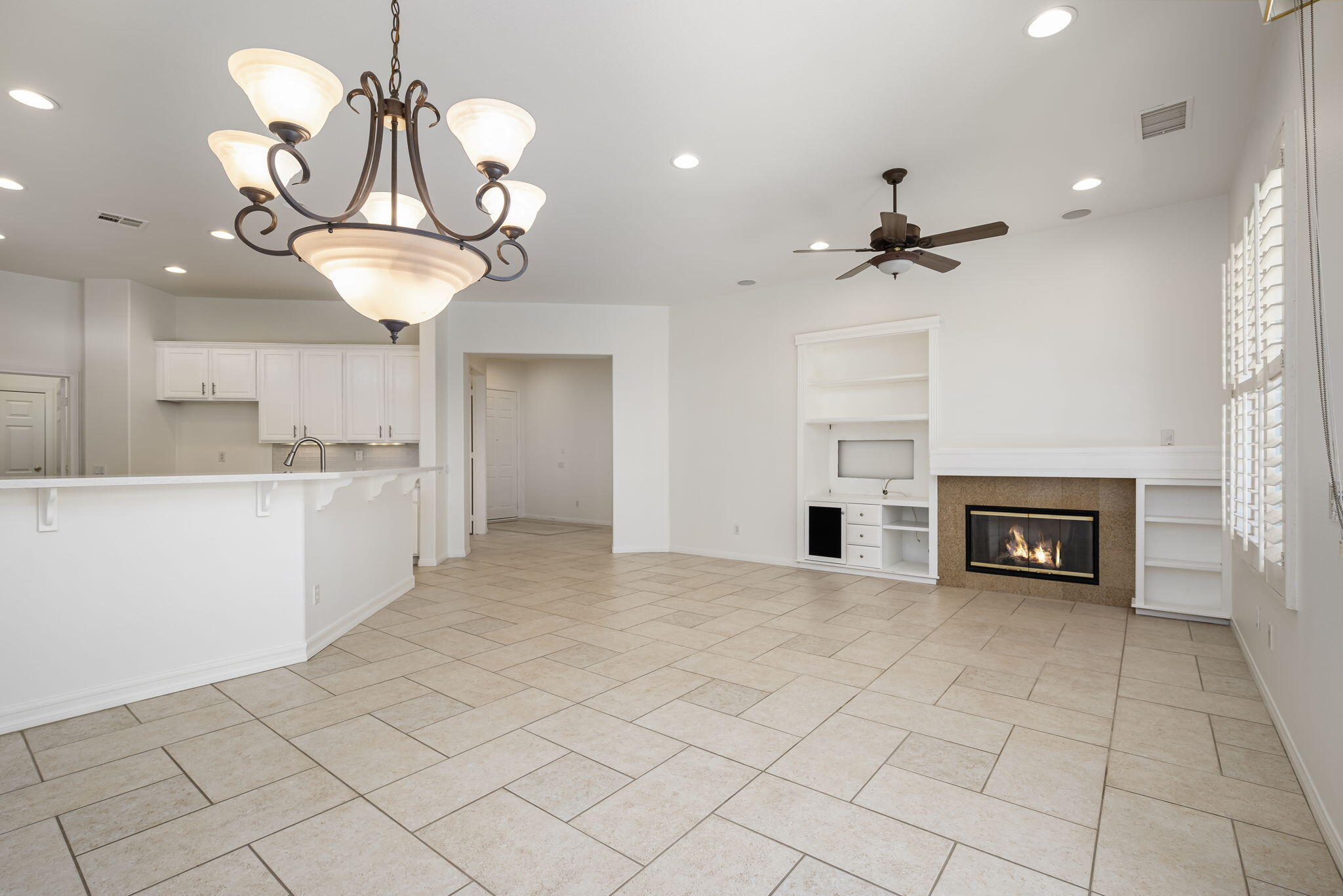 44528 Knightswood Road Indio, CA 92201 - Photo 12 of 46 a view of a kitchen with furniture and chandelier