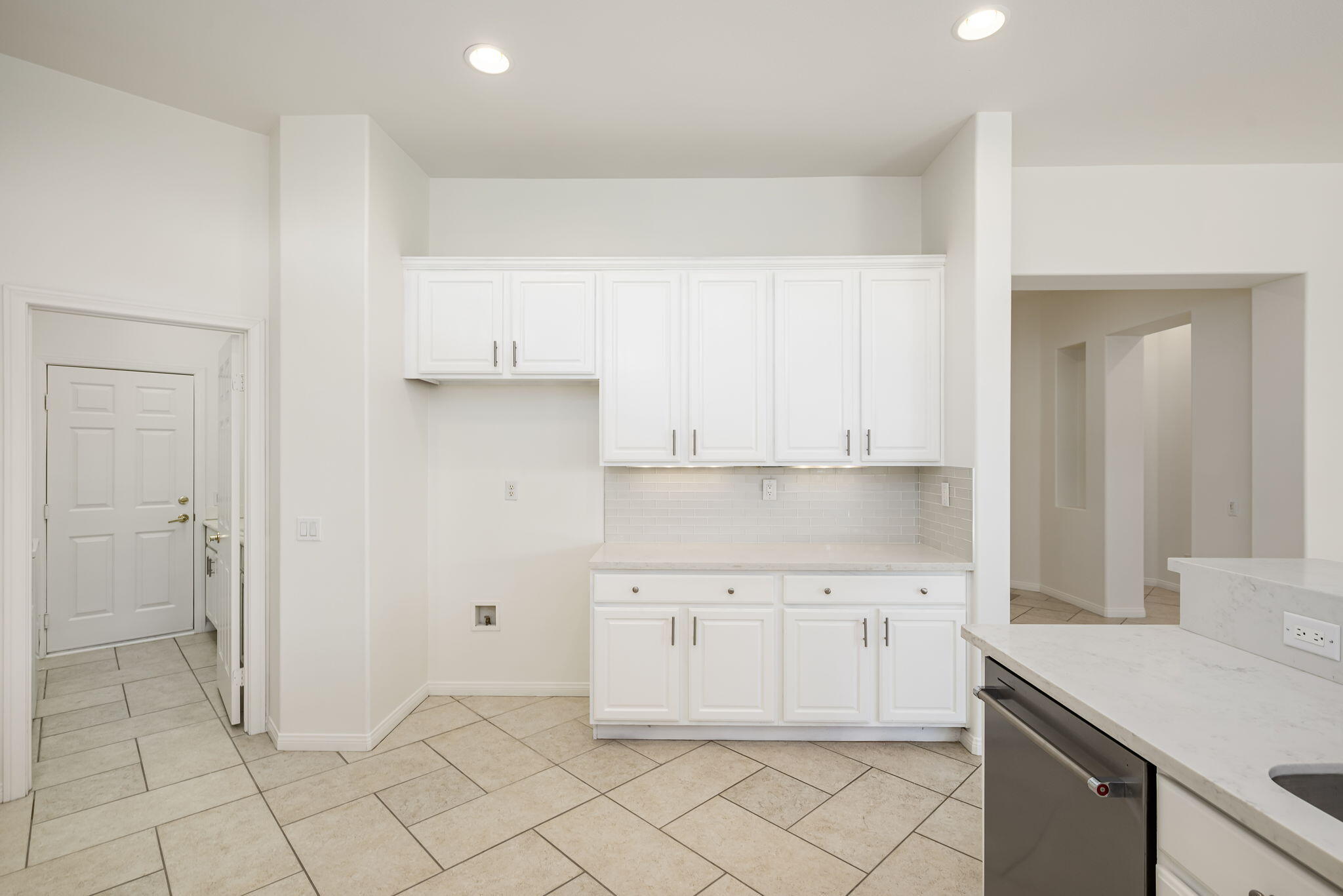 44528 Knightswood Road Indio, CA 92201 - Photo 18 of 46 a view of a kitchen with white cabinets