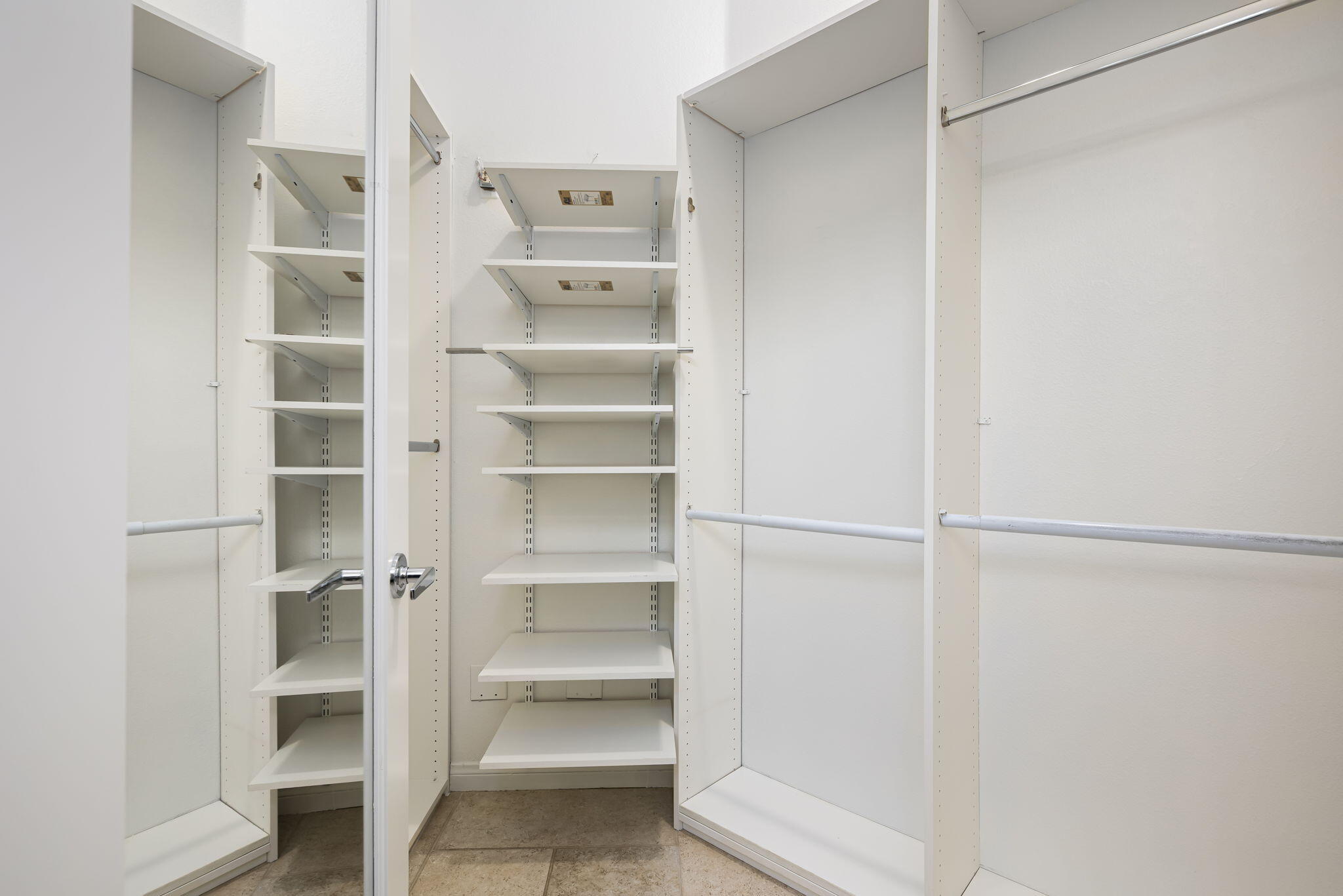 44528 Knightswood Road Indio, CA 92201 - Photo 27 of 46 a view of walk in closet with empty racks
