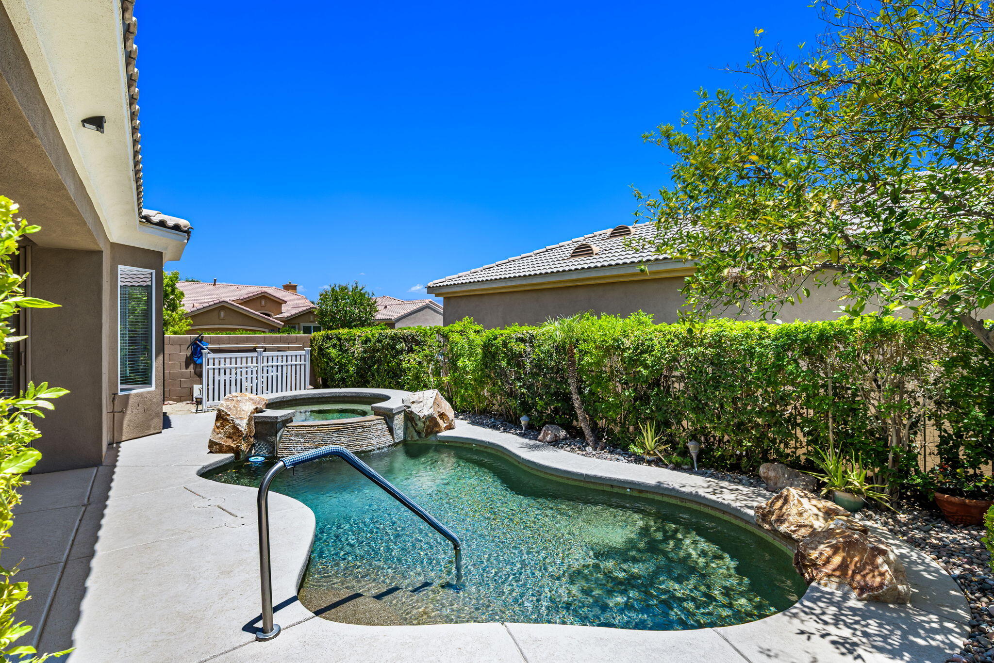 44528 Knightswood Road Indio, CA 92201 - Photo 34 of 46 a garden view with a seating space