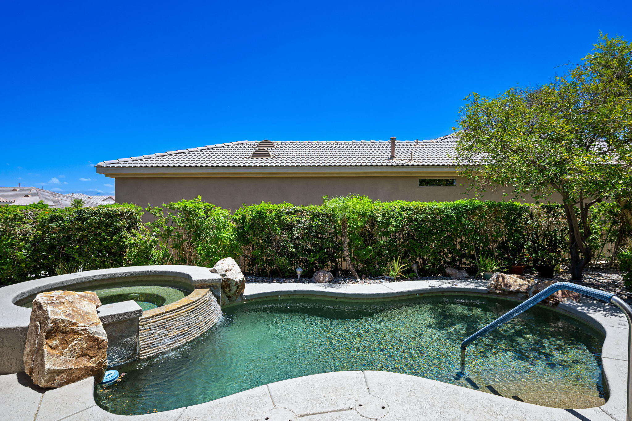44528 Knightswood Road Indio, CA 92201 - Photo 36 of 46 a view of a house with a backyard