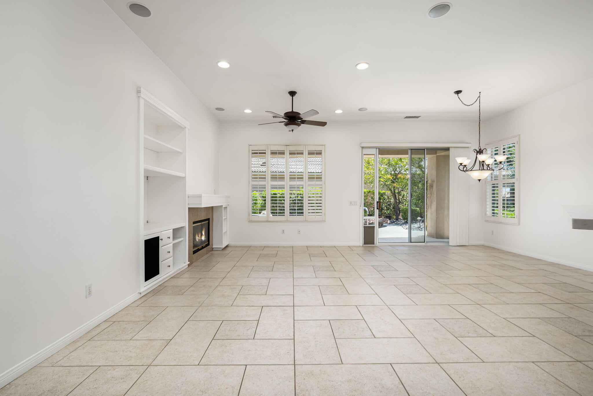 44528 Knightswood Road Indio, CA 92201 - Photo 8 of 46 a view of an empty room with kitchen and window