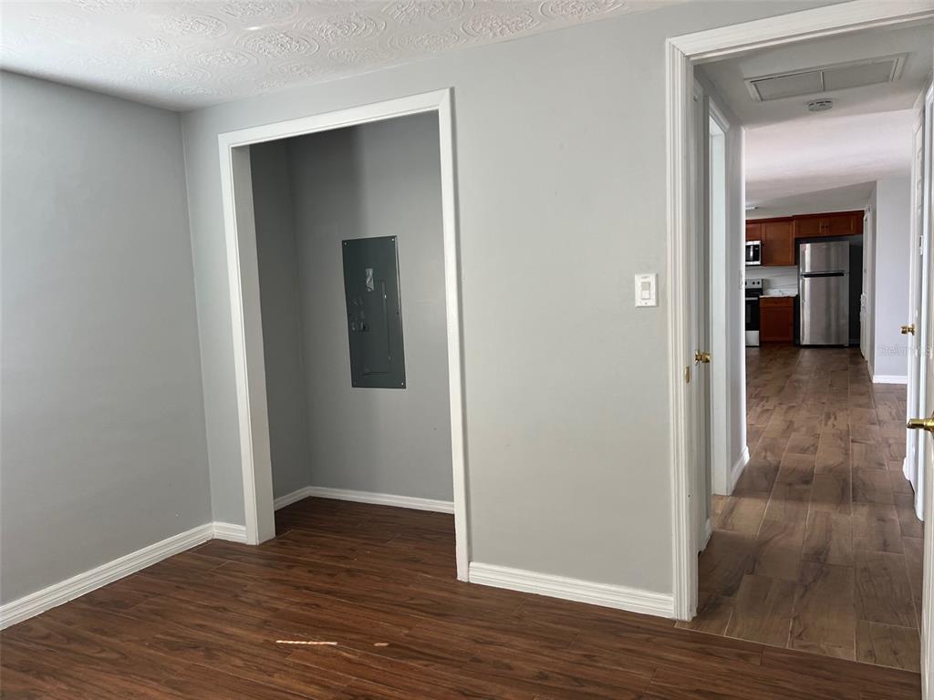 5046 Victoria Lane Holiday, FL 34690 - Photo 12 of 24 a view of a hallway with wooden floor