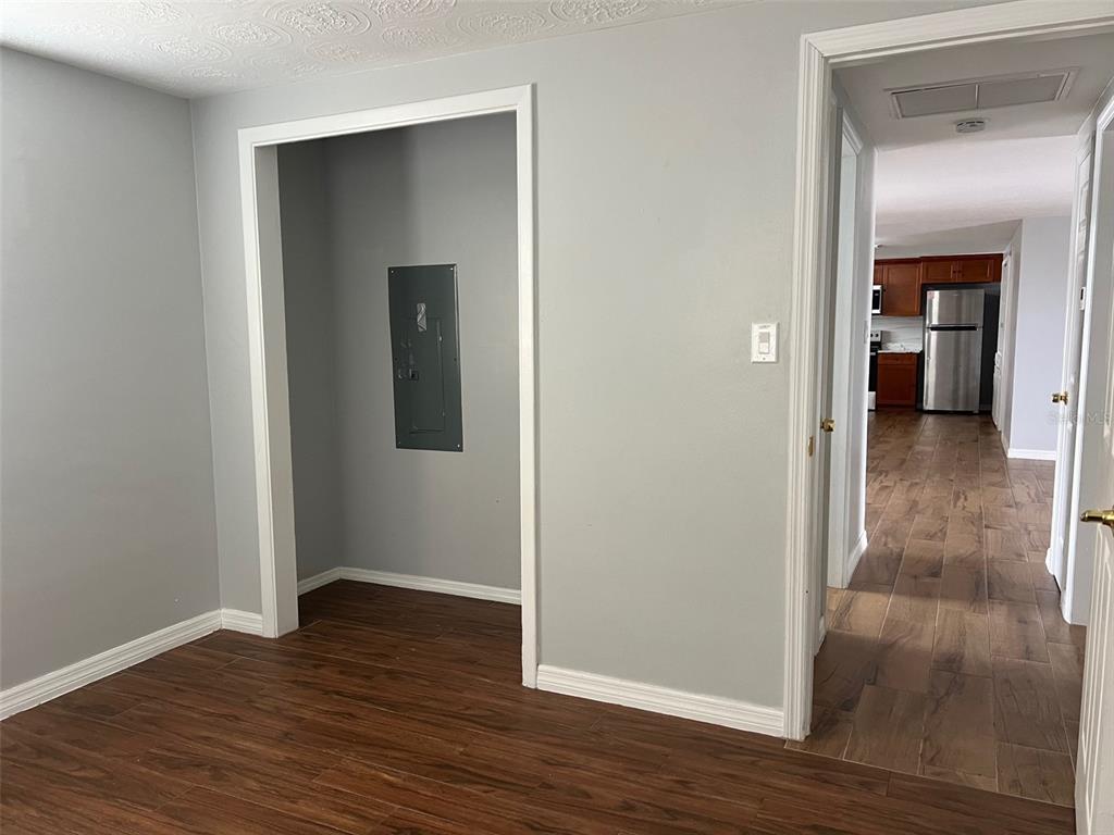 5046 Victoria Lane Holiday, FL 34690 - Photo 18 of 24 a view of a hallway with wooden floor