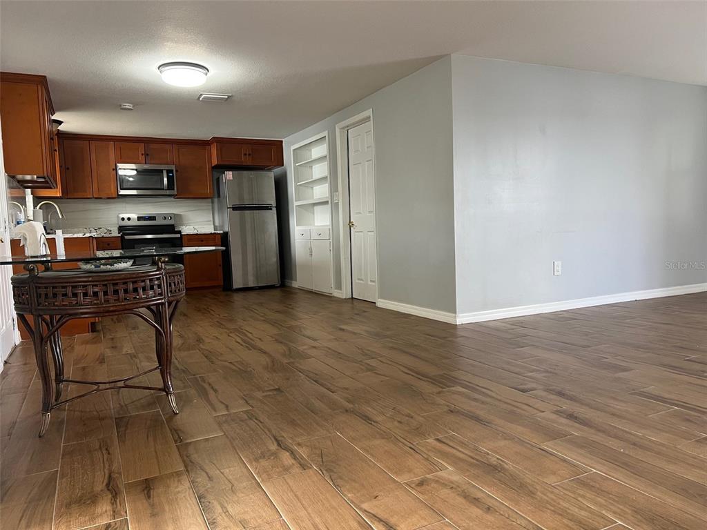 5046 Victoria Lane Holiday, FL 34690 - Photo 6 of 24 a kitchen with stainless steel appliances a refrigerator a stove top oven a sink and dishwasher