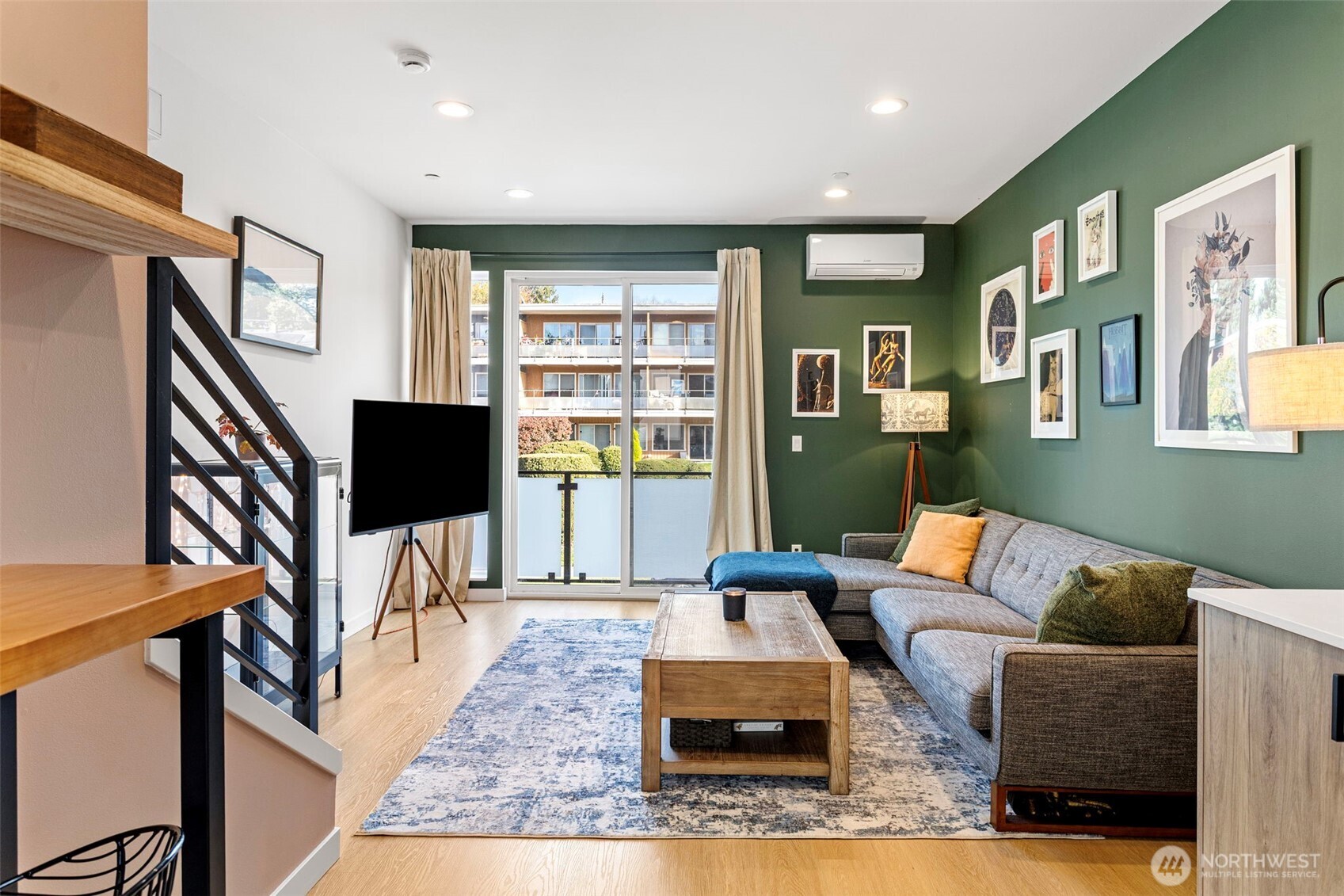 8455 Delridge Way Southwest Seattle, WA 98106 - Photo 11 of 20 a living room with furniture and a flat screen tv
