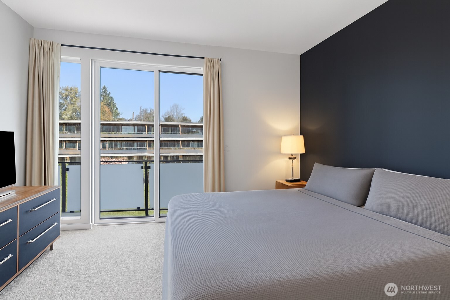 8455 Delridge Way Southwest Seattle, WA 98106 - Photo 13 of 20 a bedroom with a bed and a window