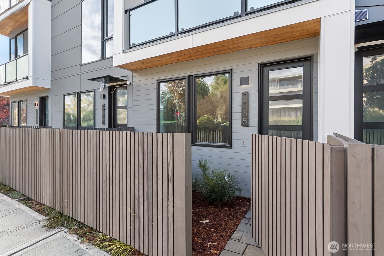 8455 Delridge Way Southwest Seattle, WA 98106 - Photo 2 of 20 a front view of a house with a garden