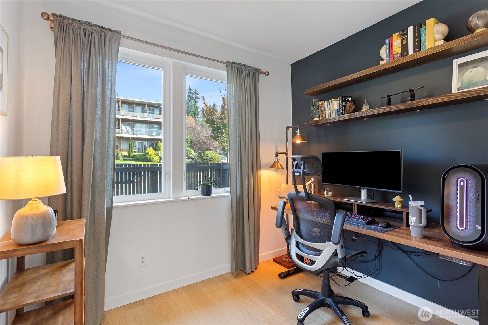 8455 Delridge Way Southwest Seattle, WA 98106 - Photo 4 of 20 a view of a workspace with furniture and a window