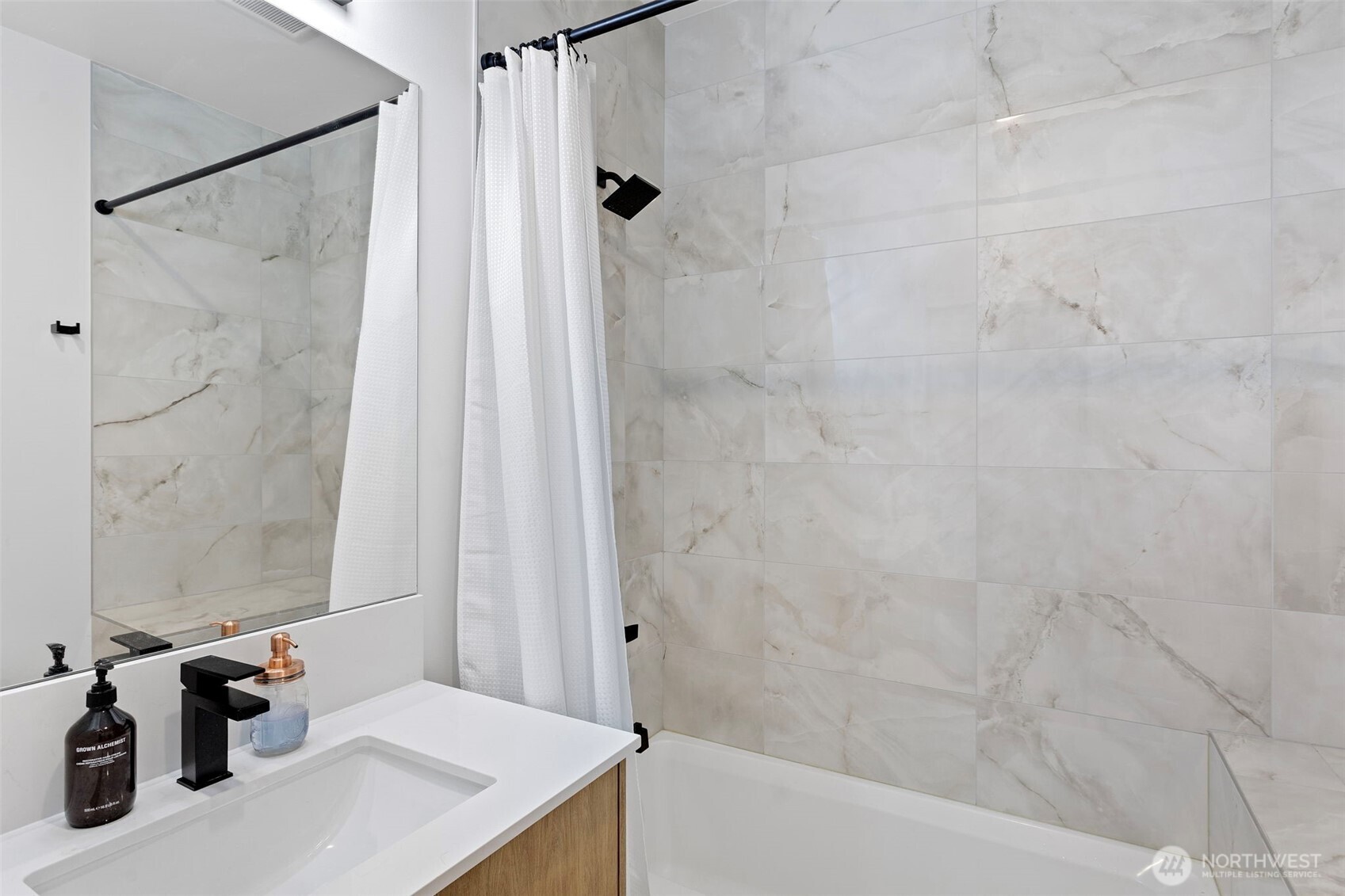 8455 Delridge Way Southwest Seattle, WA 98106 - Photo 6 of 20 a bathroom with a sink and a shower