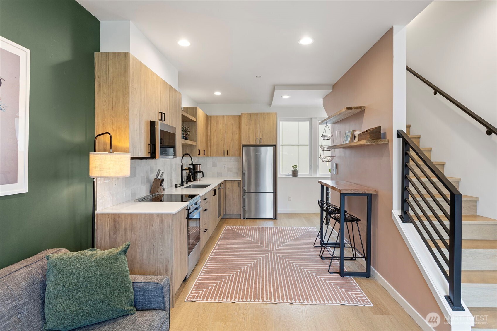 8455 Delridge Way Southwest Seattle, WA 98106 - Photo 10 of 20 a kitchen with refrigerator a sink and chairs