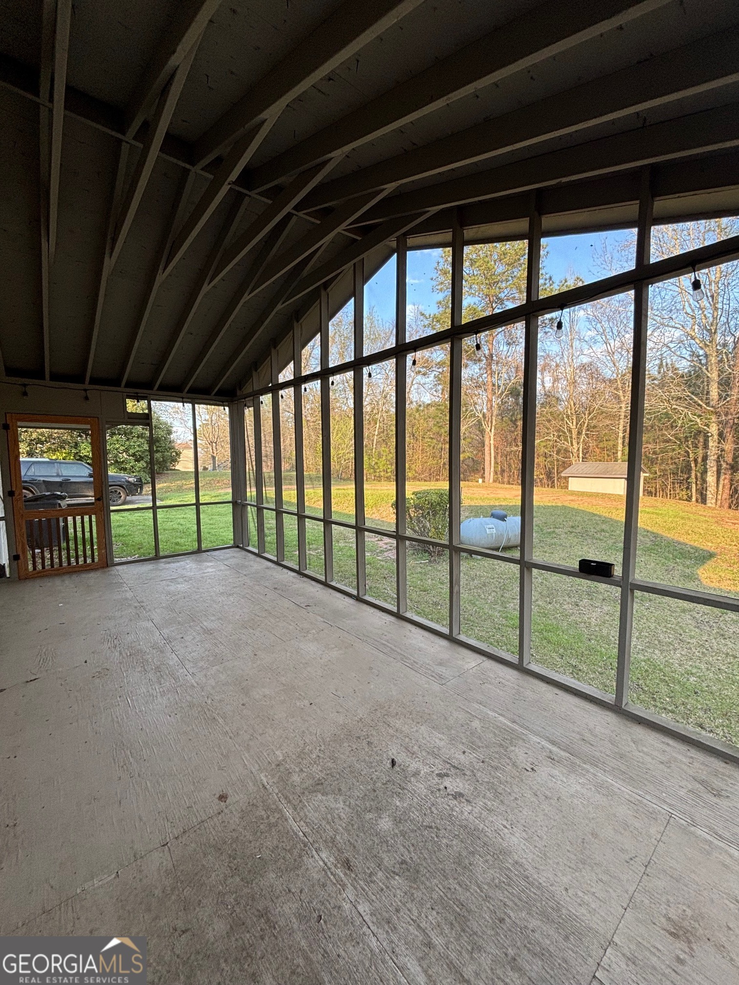 121 Girl Scout Road Lizella, GA 31052 - Photo 11 of 11 a view of outdoor room with sliding door