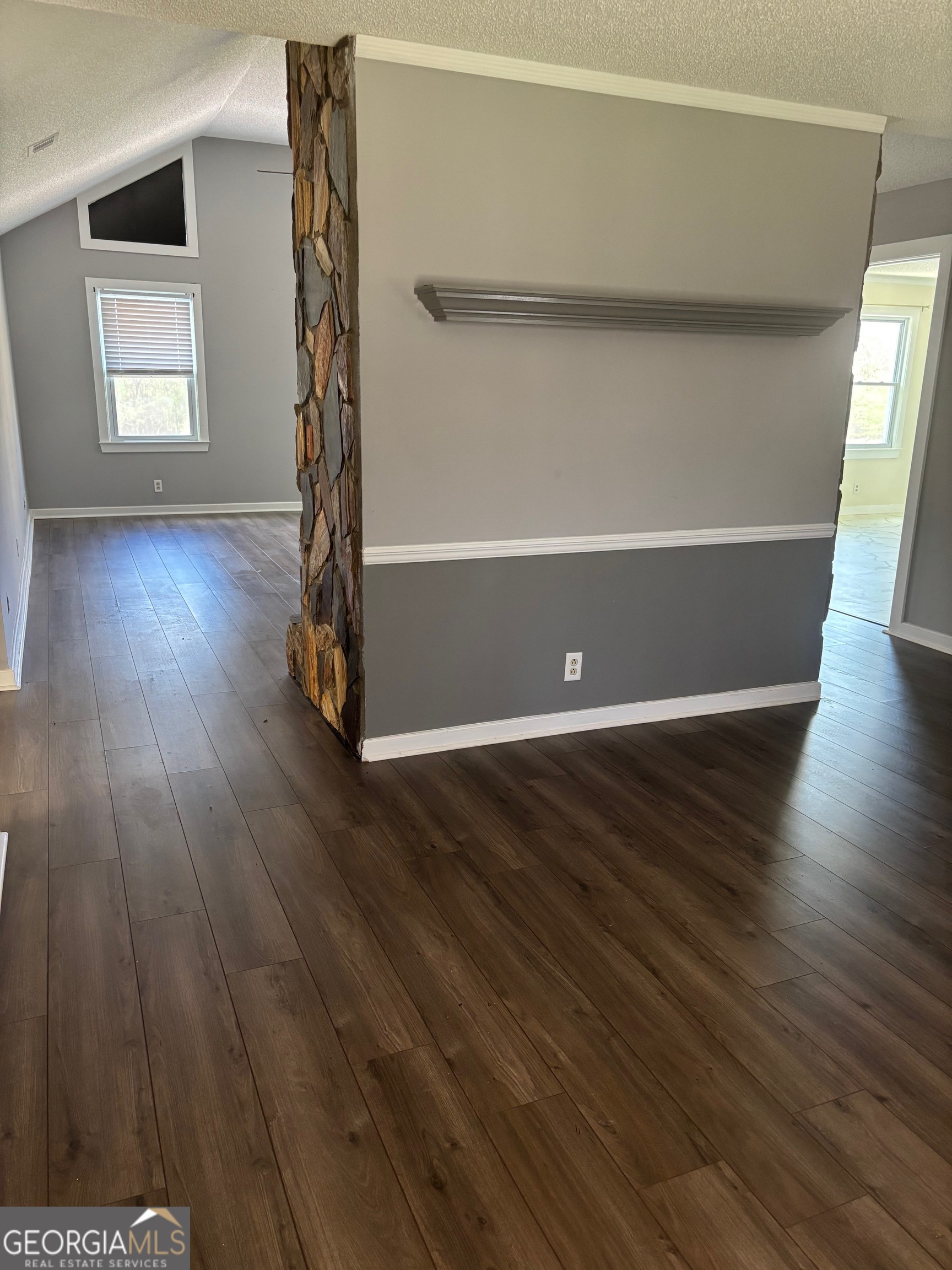 121 Girl Scout Road Lizella, GA 31052 - Photo 4 of 11 wooden floor in an empty room with a window